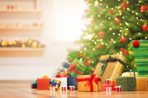 Christmas gifts under christmas tree in the sunny morning.